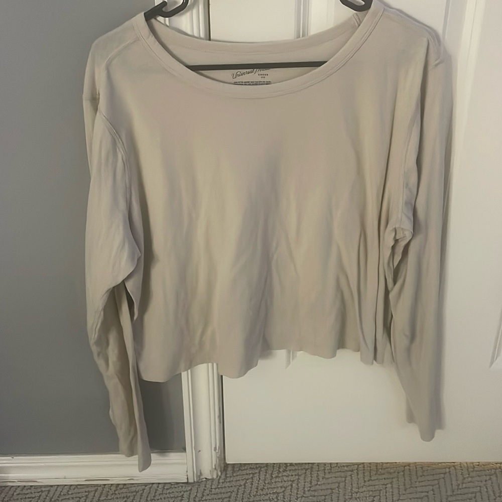 tan colored long sleeve. great quality. super thin. breathes easily.